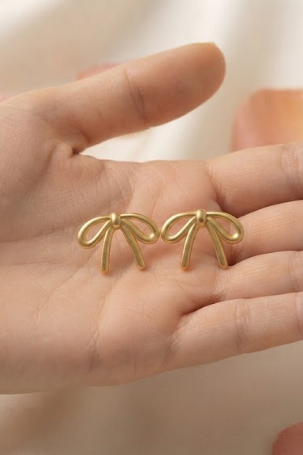 Elegant Gold Bow Stud